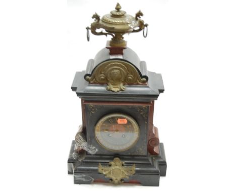 A circa 1900 black slate and brass mounted mantel clock having an enamel chapter ring with Roman numerals and eight day movem