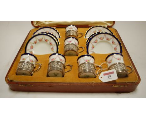 An early 20th century Aynsley porcelain six place setting coffee service, the coffee cans each having pierced silver mounts i