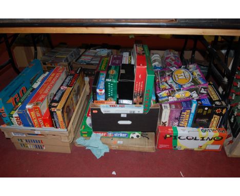 A box of assorted children's toys and games to include The Best of TV and Movies, War Hammer Dark Millennium etc