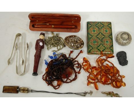 A small collection of miscellaneous items to include; pocket cigarette case, military Desert Rat cloth badge, Eastern white m