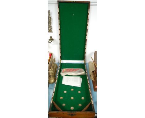 An early 20th century mahogany cased bagatelle board