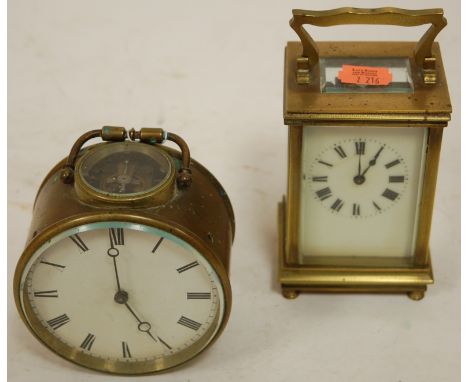 An early 20th century brass cased drum shaped carriage clock, having a white enamel dial with Roman numerals, visible platfor