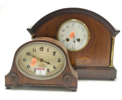 An Edwardian mahogany and chequer strung mantel clock of architectural form having an enamelled dial with Arabic numerals and