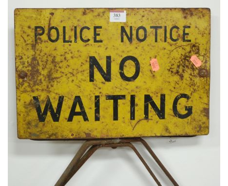 An early 20th century double sided enamel sign "Police Notice - No Waiting", on an iron base
