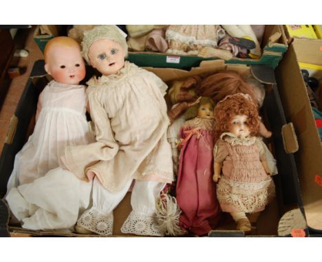 An early 20th century Armand Marseilles bisque head doll stamped AM Germany together with various other childs dolls