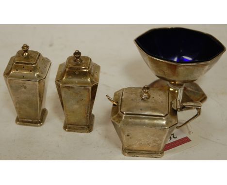 An Art Deco silver three piece cruet, of square tapered form; together with a silver open salt with blue glass liner (4) Cond