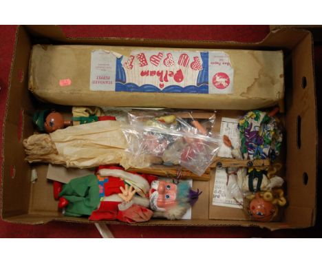 A boxed Pelham standard puppet together with various loose Pelham puppets
