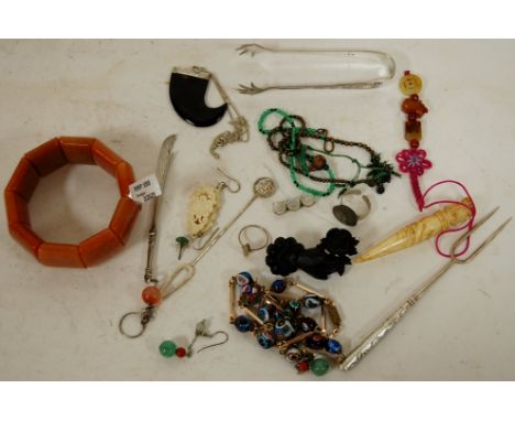 A small collection of assorted costume and other jewellery to include; carved jet brooch, white metal gem set dress ring, mod