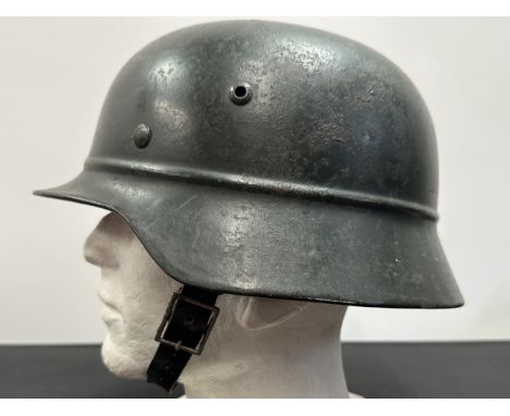 WW2 Third Reich Beaded M35 Steel Helmet with original field grey paint work. Shell is size and maker marked "ET63". Lot numbe