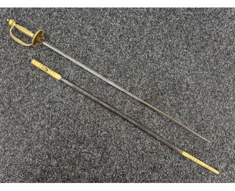 Court Sword with double edged blade 755mm in length, etched decoration, blued finish, maker marked "W Moore, London". Cast br