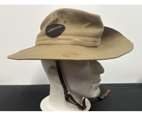 WW2 British Slouch hat with gold wire bullion arrow insignia on black backing for the 7th Indian Infantry Division. Maker mar