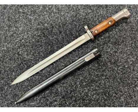 Czech VZ24 Bayonet with fullered single edged blade with upper cutting edge 297mm in length. Wooden grips. Marked between the
