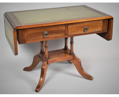 A Reproduction Mahogany Drop Leaf Coffee Table in the Form of a Sofa Table with Tooled Leather Top and Two Drawers 