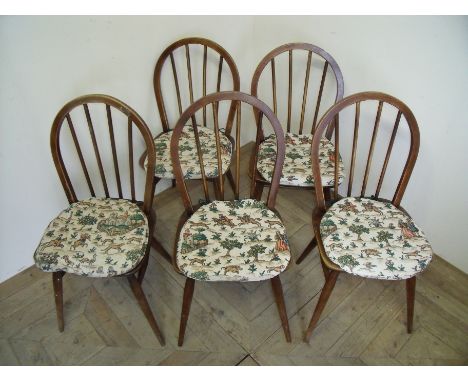 Set of four Ercol hoop back dining chairs