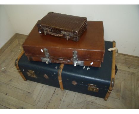 Collection of vintage luggage including a Revelation fibre suitcase a wooden bound flat top trunk and a small crocodile skin 