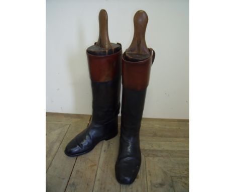 Pair of gents vintage two tone black & tan leather riding boots with wooden trees (length of sole 29cm, 42cm high, calf 42cm)