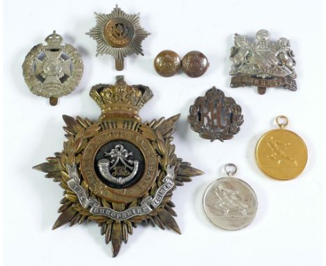 SELECTION OF MILITARY BADGES AND MEDALLIONS, including late Nineteenth or early Twentieth Century LARGE SHROPSHIRE REGIMENT G