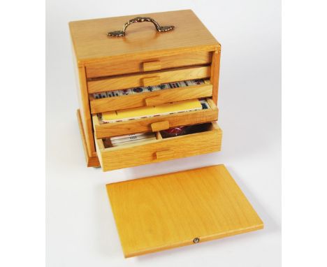 MODERN LIGHT OAK TABLE TOP SMALL CHEST OF FIVE DRAWERS, containing a bamboo backed Mah Jong set 