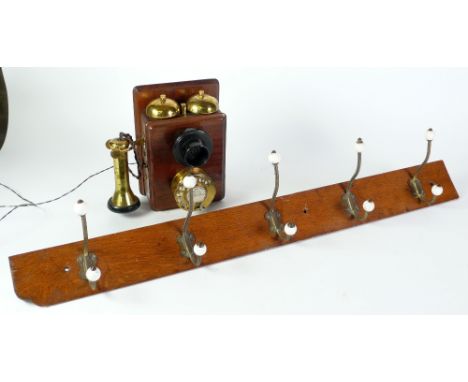 GPO WALL MOUNTED TELEPHONE, mahogany case, with two brass bells, brass dial and brass tulip earpiece and fitted bakelite mout