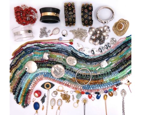 A large quantity of jewellery, including various hardstone bead necklaces, a silver bangle, a silver circular pendant, a chas