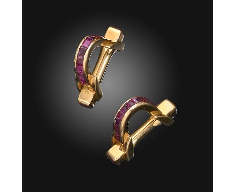 A pair of French ruby-set gold A-form cufflinks, the hoops set with a line of calibré-cut rubies and with further square-shap