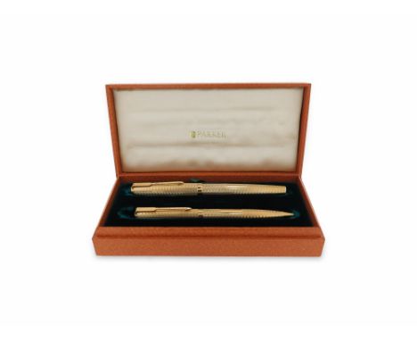 An 18ct gold Parker pen and pencil, Presidential Duette, with engine-turned decoration and London hallmarks for 1968, case
