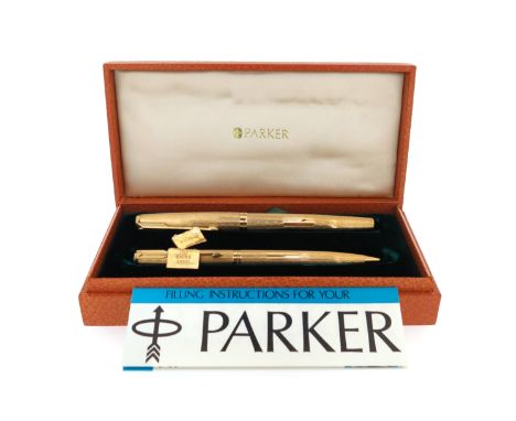 An 18ct gold Parker pen and pencil, Presidential Duette, with engine-turned decoration and London hallmarks for 1968, case