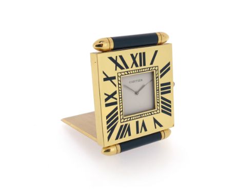 A travelling clock by Cartier, the square chapter ring with blue enamel Roman numerals, plain white dial signed 'Cartier' wit