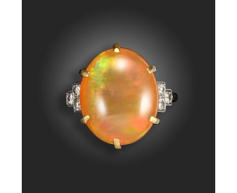 An oval-shaped opal and diamond ring, the predominately orange opal with green and red flash set in gold with three small cir