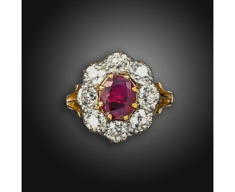 A Victorian ruby and diamond cluster ring, the oval-shaped ruby set within a surround of eight old cushion-shaped diamonds we