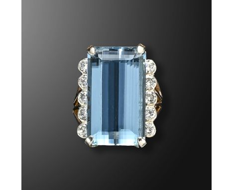 An aquamarine and diamond ring, the rectangular step-cut aquamarine weighs approximately 18.00cts, with a line of five round 