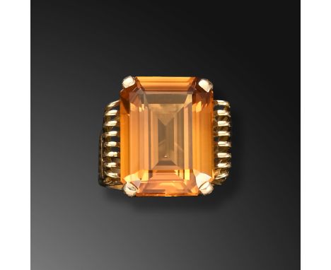 A French citrine-set gold ring, the rectangular step-cut citrine is claw-set, with ornate wirework shoulders and gallery in g