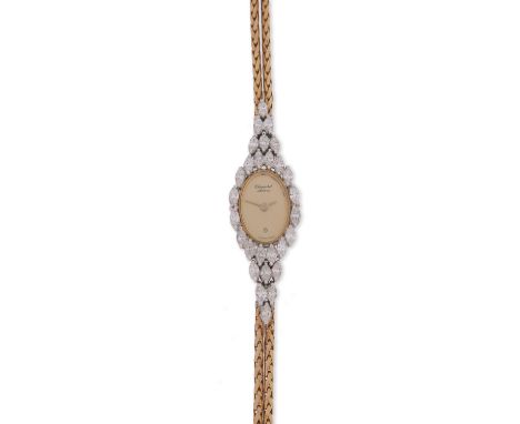 A lady's diamond wristwatch by Chopard, the signed gold dial set within a surround of marquise-shaped diamonds on flexible go