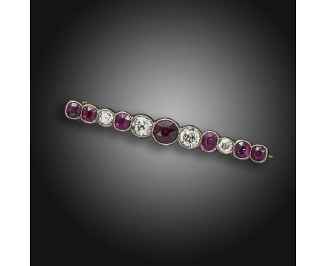 A ruby and diamond bar brooch, centred with an old circular-cut ruby, with further graduated old circular-cut diamonds and cu
