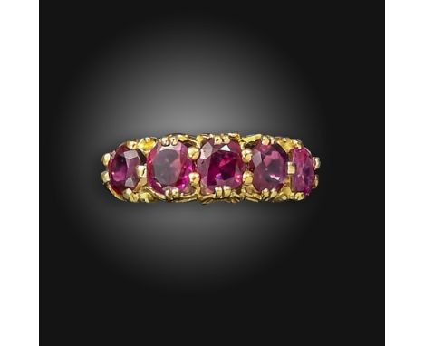 A ruby five-stone ring, the graduated oval-shaped rubies set in yellow gold, Birmingham marks for 14ct gold, size T Accompani