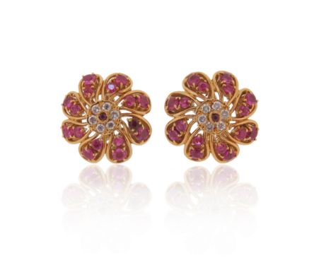 A pair of ruby and diamond-set circular foliate earrings, centred with a ruby and circular-cut diamond cluster and with two g