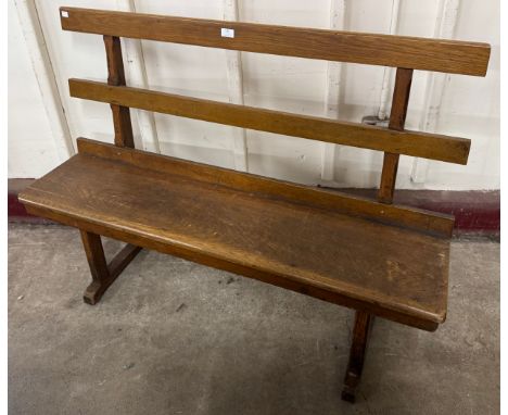 An early 20th Century oak bench 