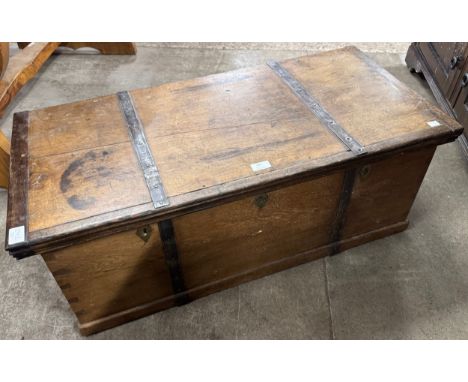 A Victorian teak and burnished steel bound trunk 