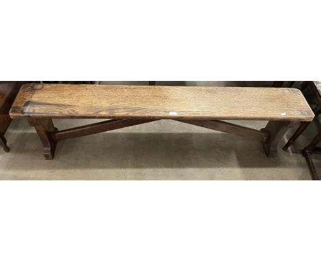 An early 20th Century oak gymnasium bench 