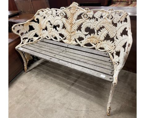 A Victorian style painted cast iron fern pattern garden bench, manner of Coalbrookdale