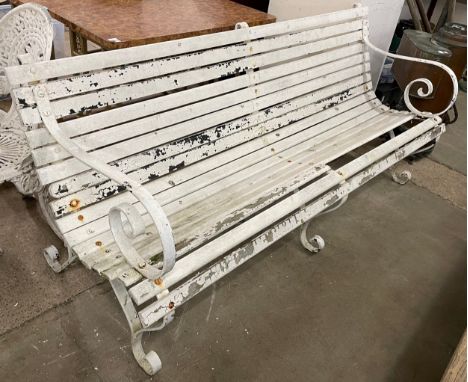 A Victorian painted wrought iron garden bench 