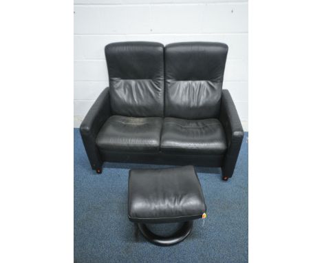 AN EKORNES STRESSLESS TWO SEATER RECLINING SOFA, length 127cm x depth 85cm x height 88cm, along with a matching footstool (co