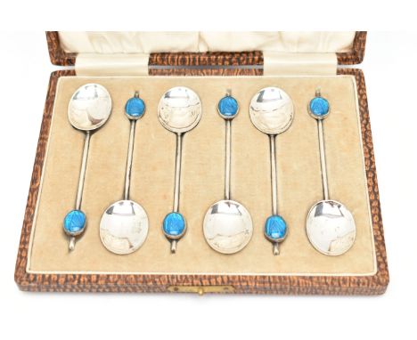 A CASED SET OF SIX EARLY 20TH CENTURY SILVER COFFEE SPOONS, each spoon set with a blue guilloche enamel cabochon to the handl