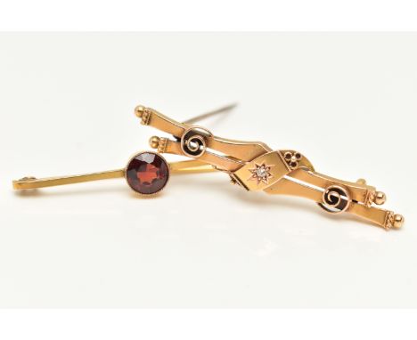 TWO BROOCHES, two gem set brooches, the first an early 20th century diamond bar brooch with central old cut diamond in a star