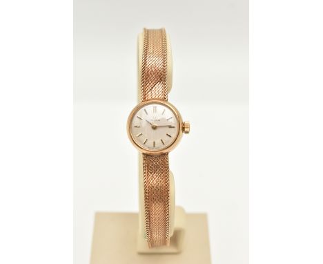 A LADIES 9CT 'OMEGA' WRISTWATCH, manual wind, small round silver dial signed 'Omega', baton markers, within a polished case, 