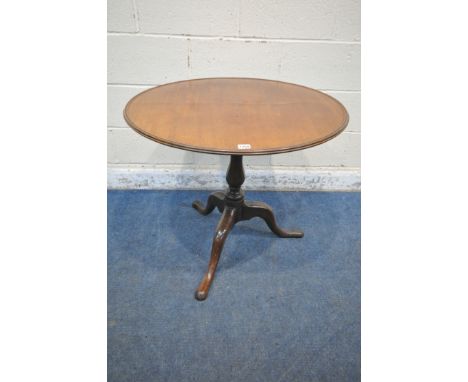 A GEORGIAN MAHOGANY DISH TOP TRIPOD TABLE, the tilt top raised on a turned support, with three shaped legs, diameter 77cm x h