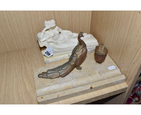 A MARBLE MOUNTED INKWELL AND STUDY OF A RECLINING PARTIALLY NUDE WOMAN comprising an inkwell with a bronzed figure of a peaco