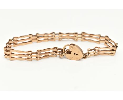 A 9CT GOLD GATE BRACELET, three bar bracelet, fitted with a heart padlock clasp and additional safety chain, hallmarked 9ct B