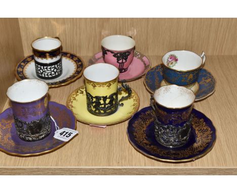 SIX COFFEE CUPS WITH SAUCERS to include a pair of Coalport mounted coffee cups with saucers with gilt swag patterns on blue a