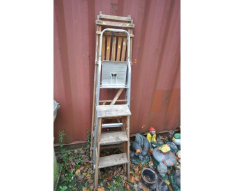 A SET OF WOODEN STEP LADDERS, height 177cm, a smaller set of wooden step ladders, along with a set of metal aluminium ladders